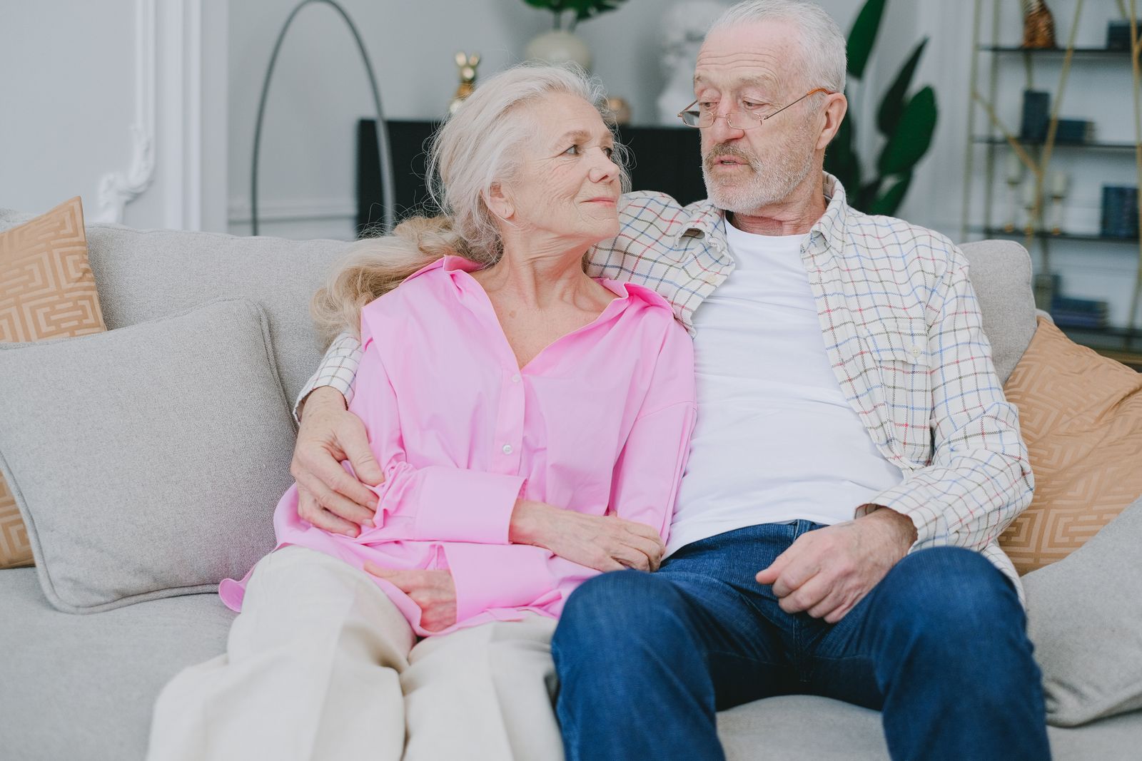 An older couple sitting together at home