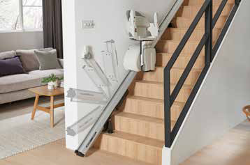 The Access HomeGlide parked at the foot of a staircase, seen from an adjoining living room