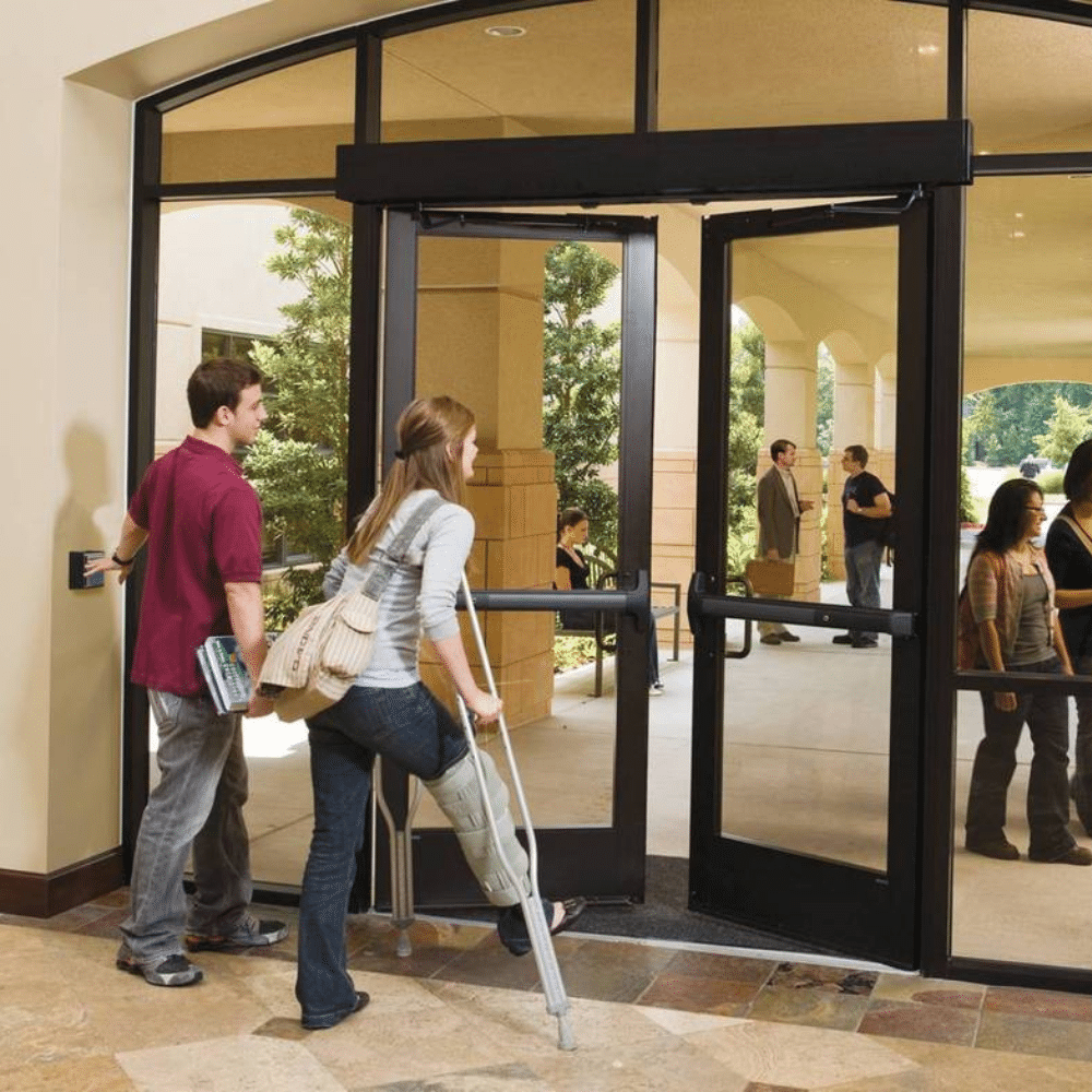 Wall mounted push plate beside an accessible door