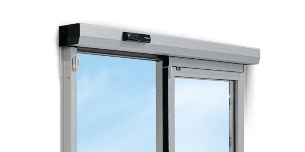 Door operator header with activation hardware above a sliding door