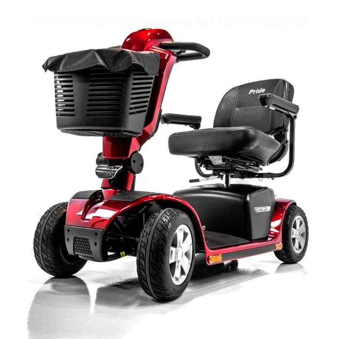 Red four-wheel Pride mobility scooter with a front basket, studio product photograph