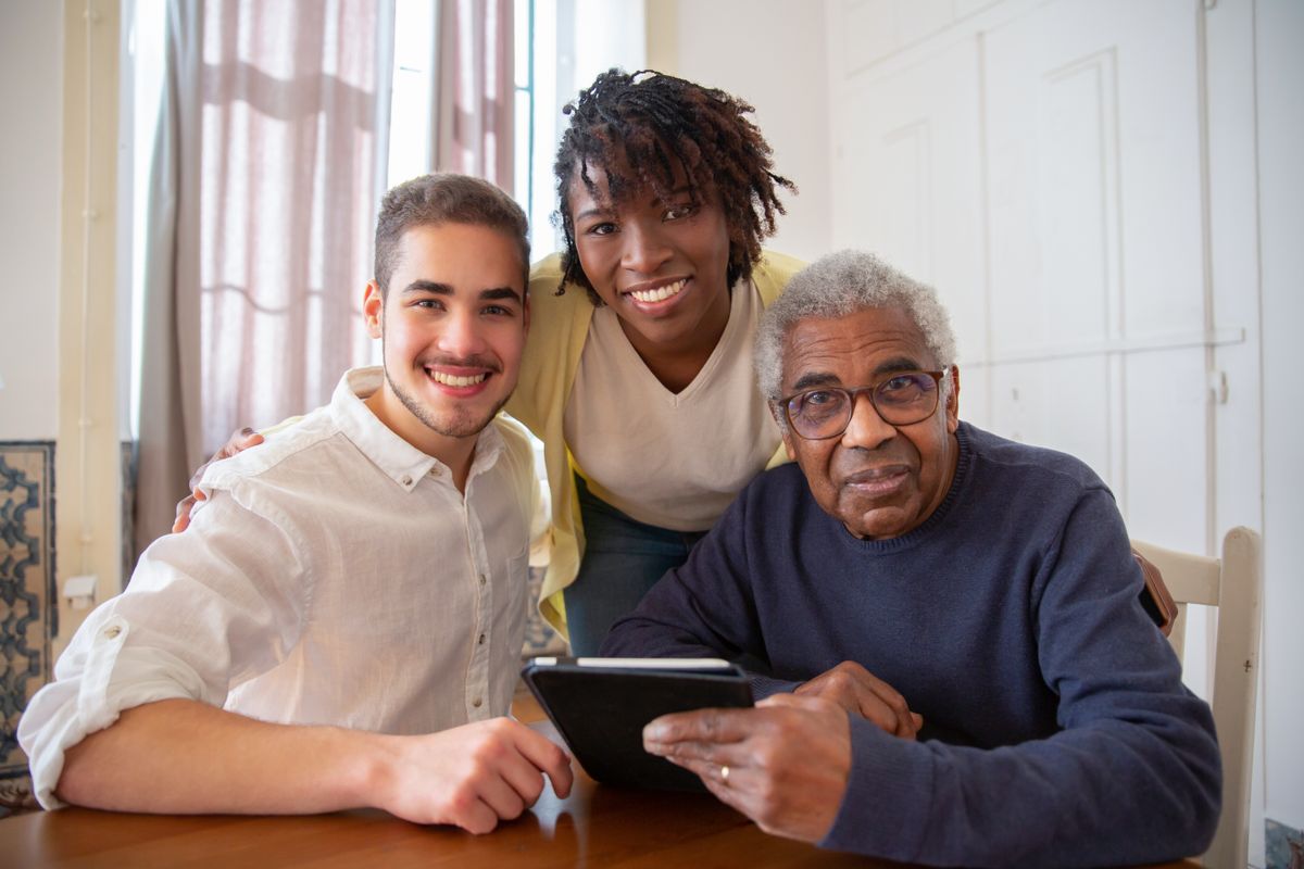A family sitting together in a living room at home