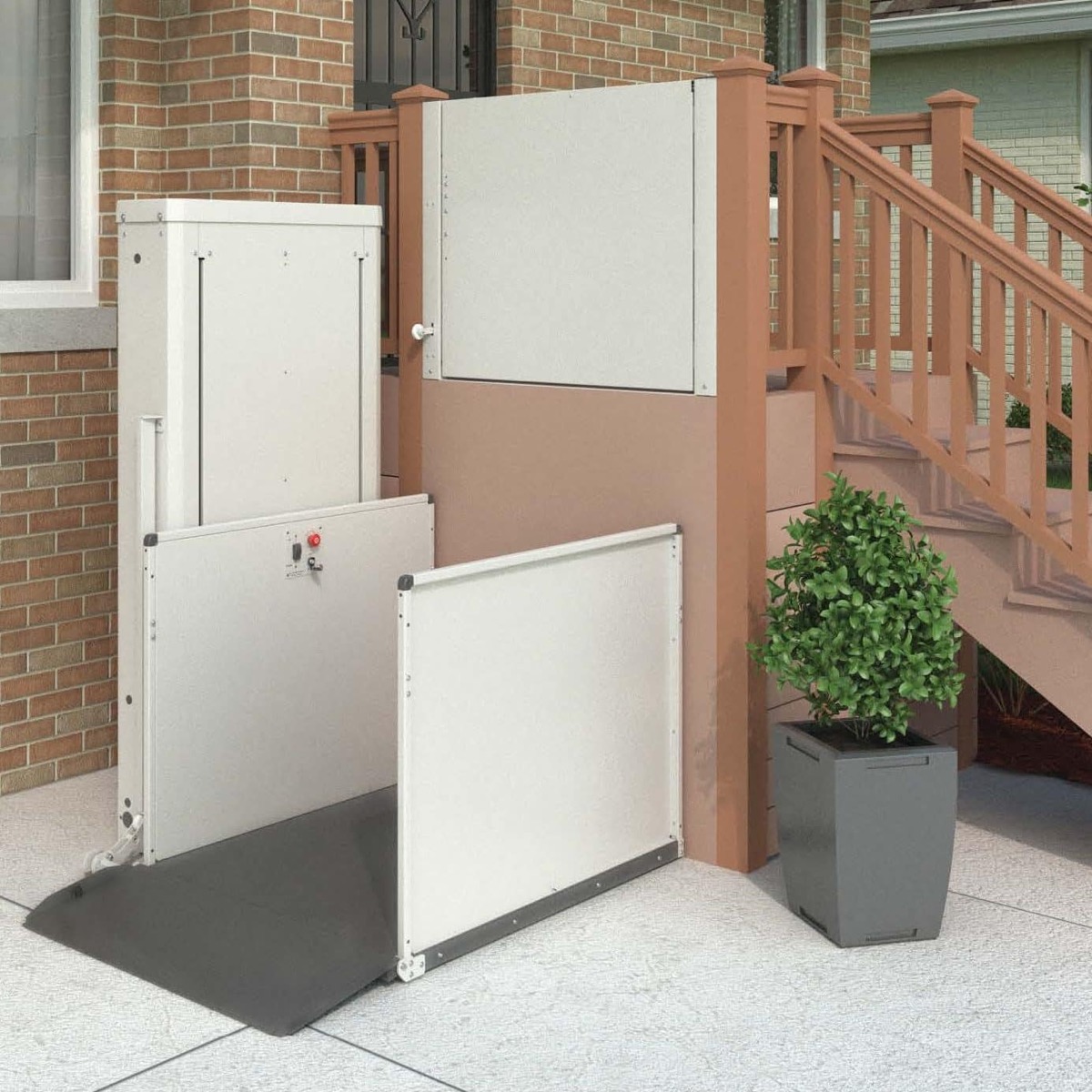 A vertical platform lift installed at a raised house entrance