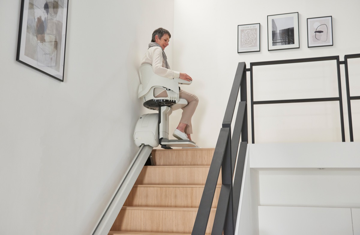 An Access HomeGlide arriving at the top of a straight staircase