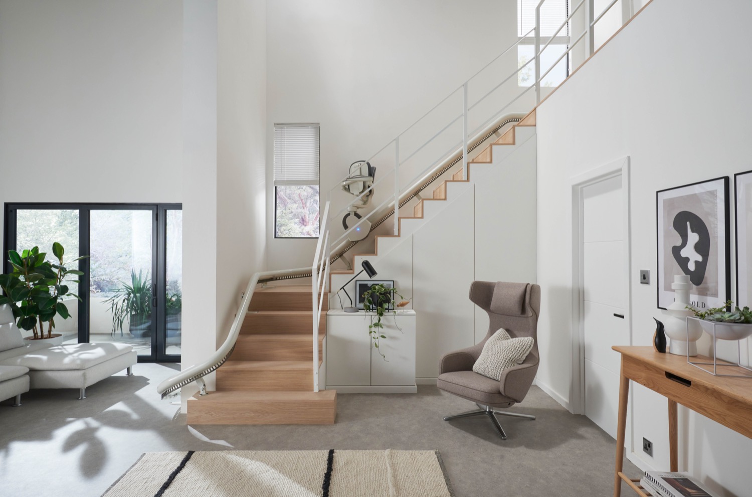 A curved stairlift rail following the bend of a staircase